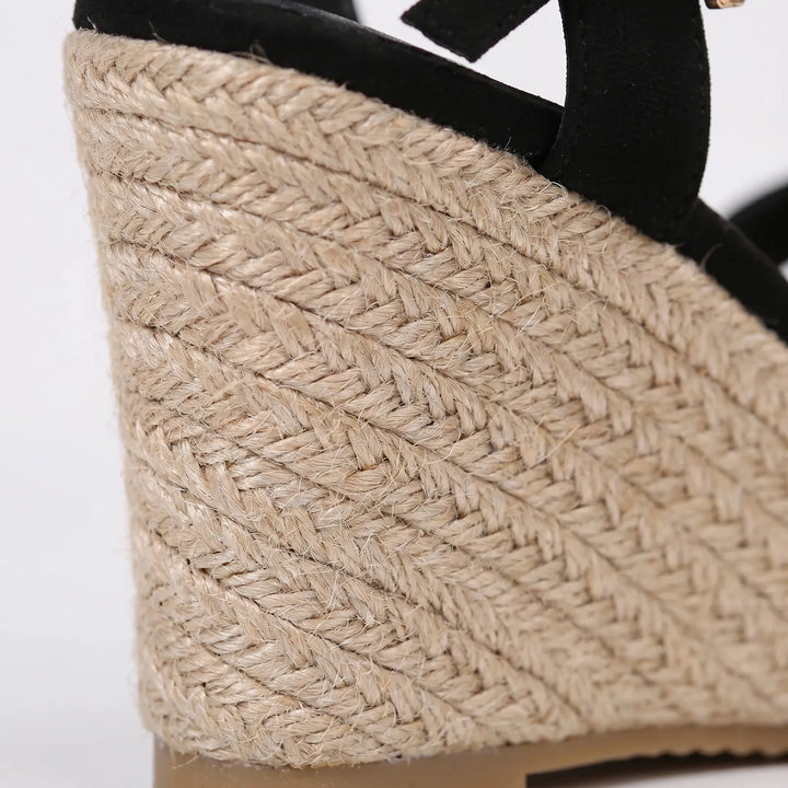 Comfortable women's wedge sandals with platform sole & adjustable strap, ideal for all-day summer wear.