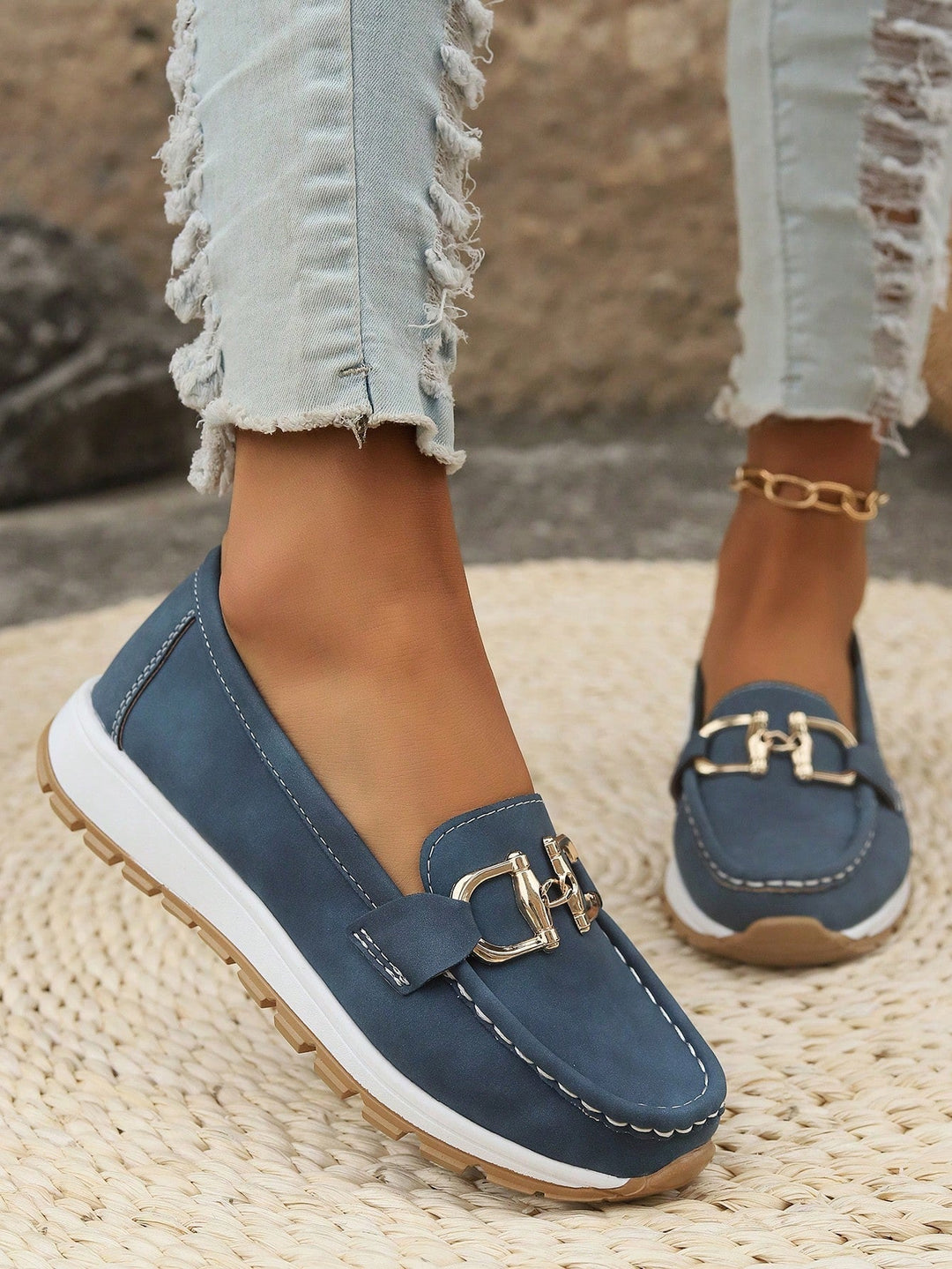 Stylish women's faux leather flat buckle loafers, providing comfortable slip-on footwear for daily use.