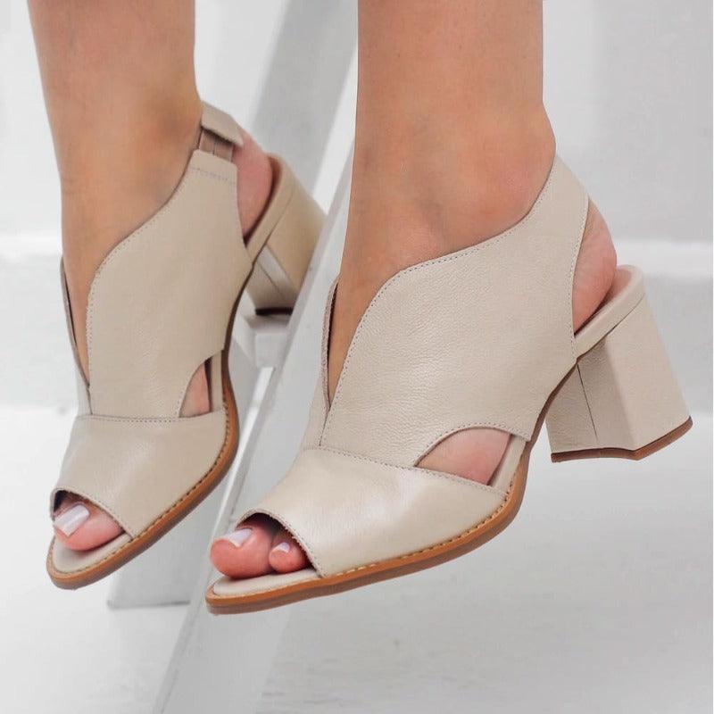 Women's heeled sandals with comfortable block heel. Versatile, elegant summer footwear.