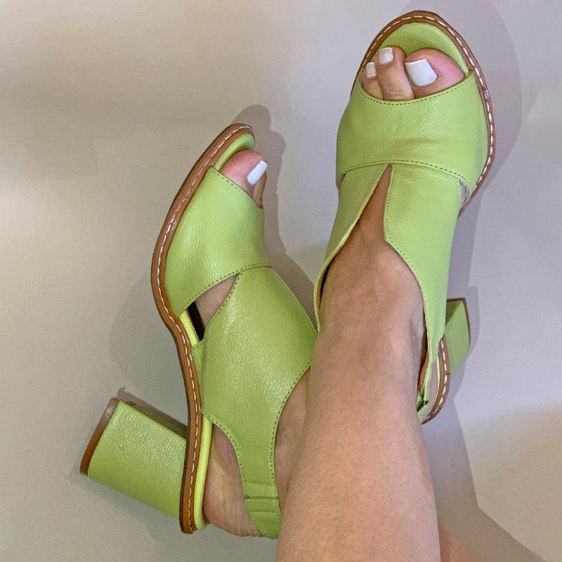 Detail of comfortable block heel & elegant buckle on women's versatile dress sandals.