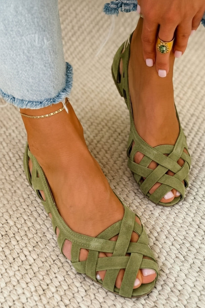 Braided women's crossover strap sandals. Stylish and comfortable flat casual slip-on summer footwear.