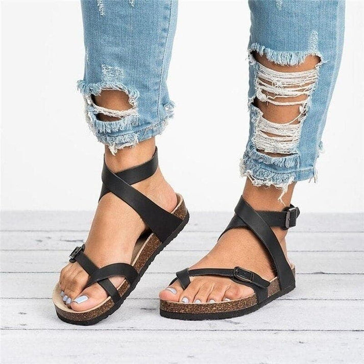 Stylish women's flat multi-strap sandals with an open toe design. Perfect for everyday summer comfort.