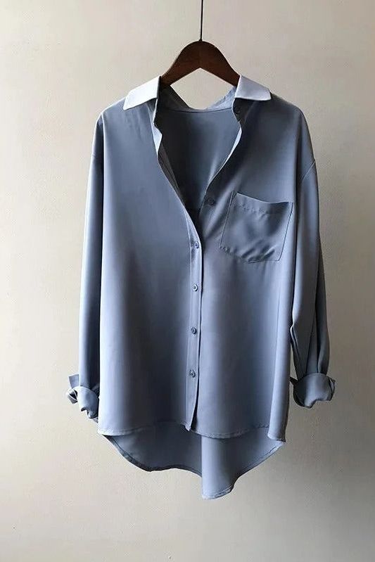 Women's comfortable flowy blouse, elegant everyday style. Versatile for casual or office wear.