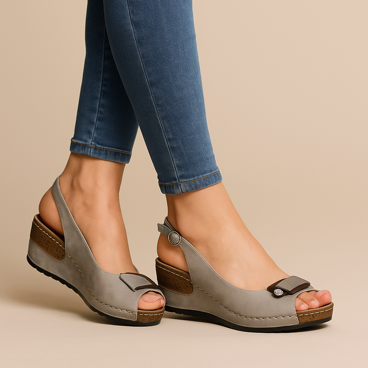 Fashionable women's low wedge peep toe slingback sandals with adjustable strap for summer comfort.
