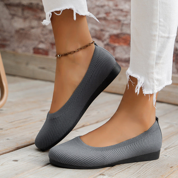 Orthopedic women's flats, slip-on style, designed for comfortable all-day wear and foot support.