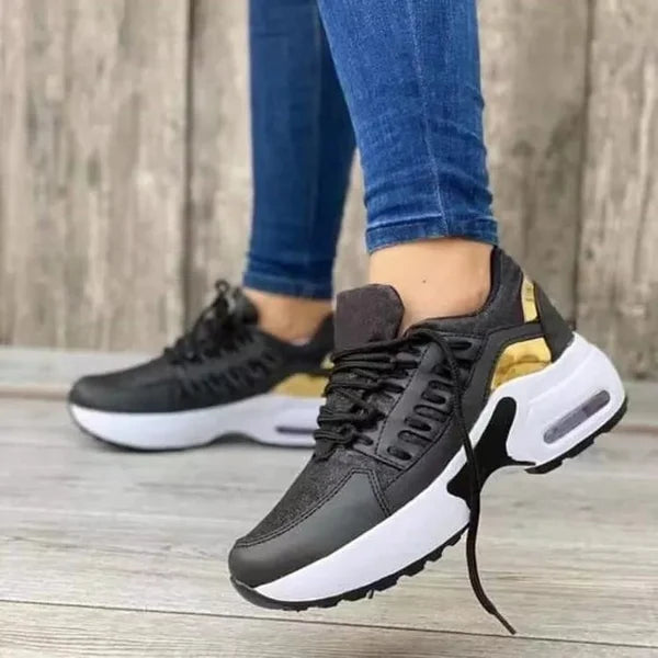 Close-up of women's orthopedic sneakers, highlighting advanced cushioning for superior foot support.