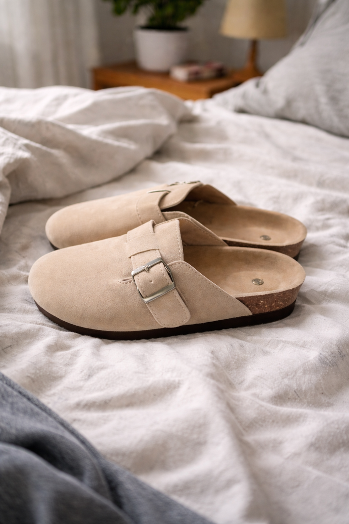 Stylish women's summer clogs; comfortable slip-on footwear with decorative buckle straps for casual elegance.