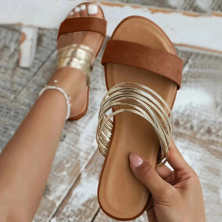 Effortless slip-on flat sandals for women, ideal for summer comfort & everyday wear.