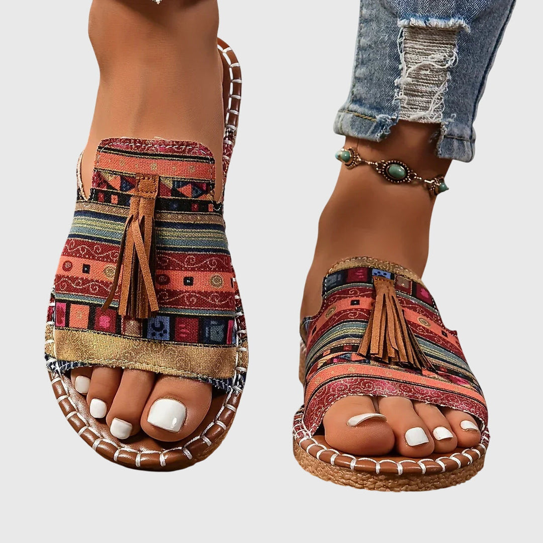 Women's comfortable slip-on sandals with stylish tassel straps. Perfect for summer casual wear.