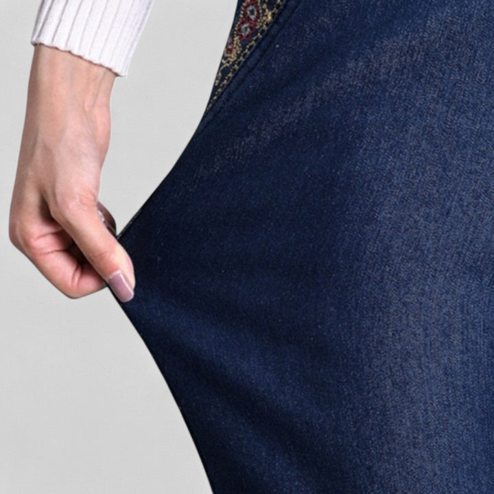 Stylish women's stretch jeans with elastic waist, functional pockets, and a relaxed comfortable fit.