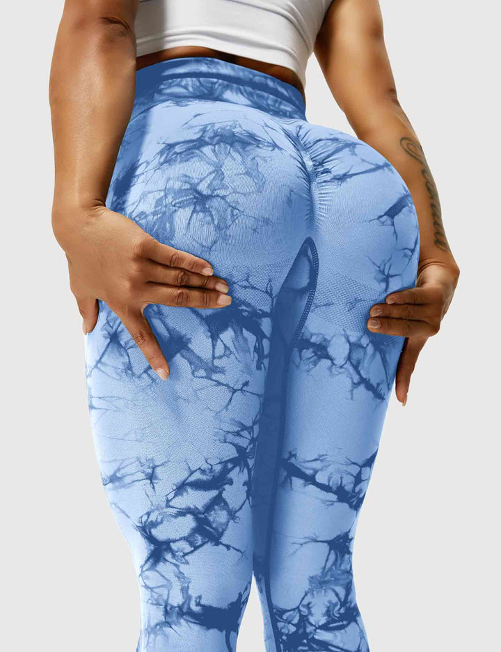Form-fitting high-waist tie dye leggings for women's fitness.