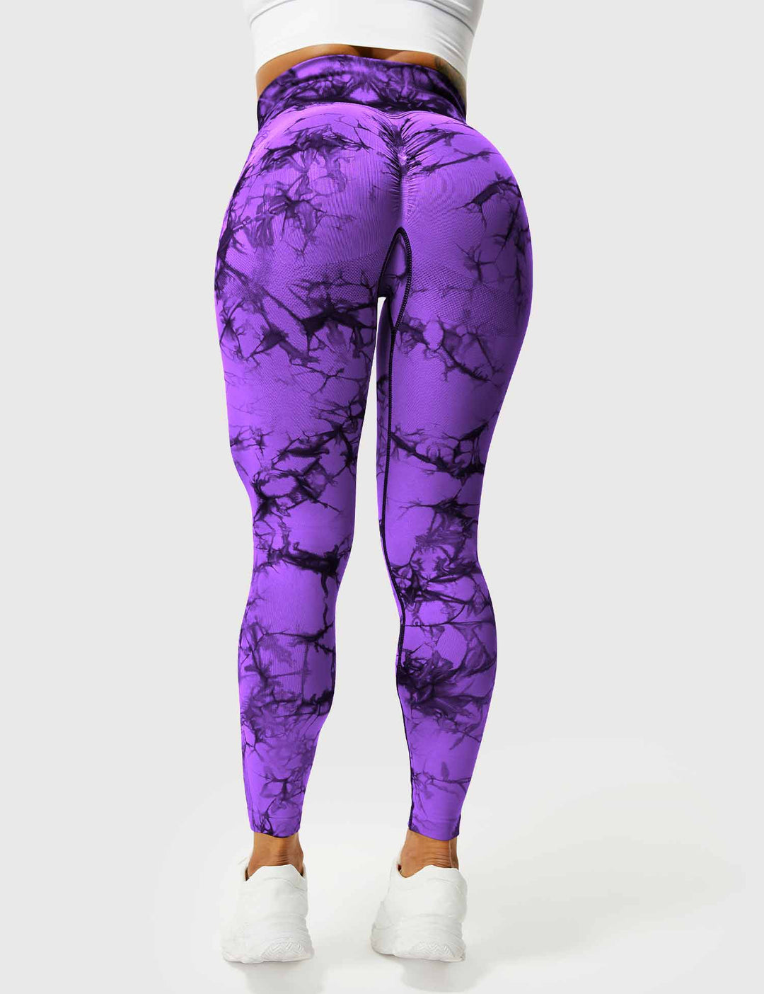 Side view of stylish high-waist tie dye leggings for women's fitness.