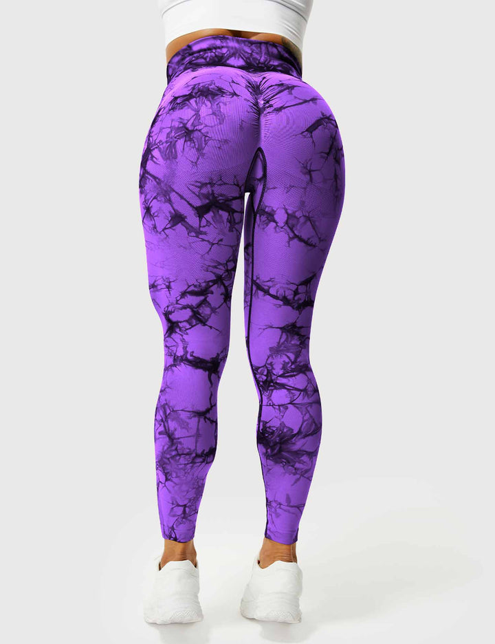 Side view of stylish high-waist tie dye leggings for women's fitness.
