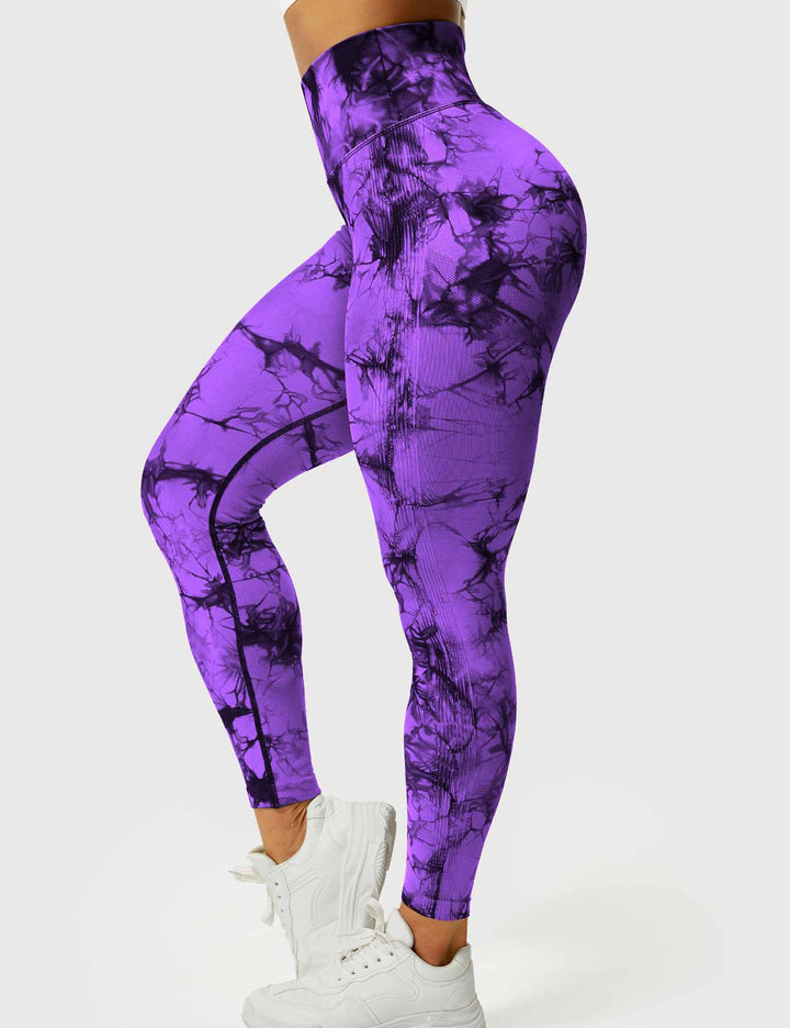 Model wearing women's tie dye high-waist leggings for yoga.