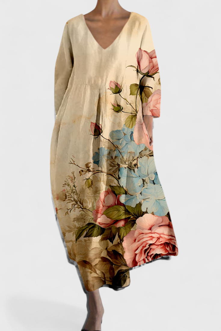 Elegant flowy V-neck midi dress. Women's comfortable summer fashion in a vibrant multicolor.