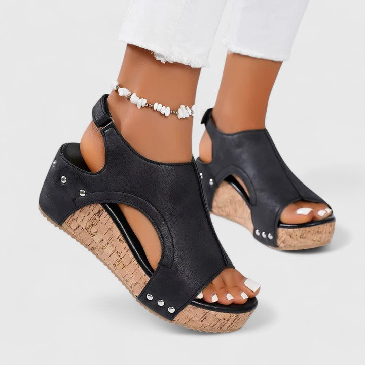 Close-up of women's comfortable wedge sandals showcasing arch support technology and quality material.