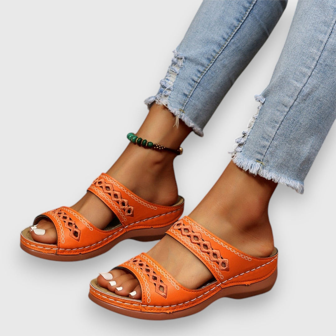 Slip-on women's sandals with a wide, relaxed fit for daily comfort and ease.