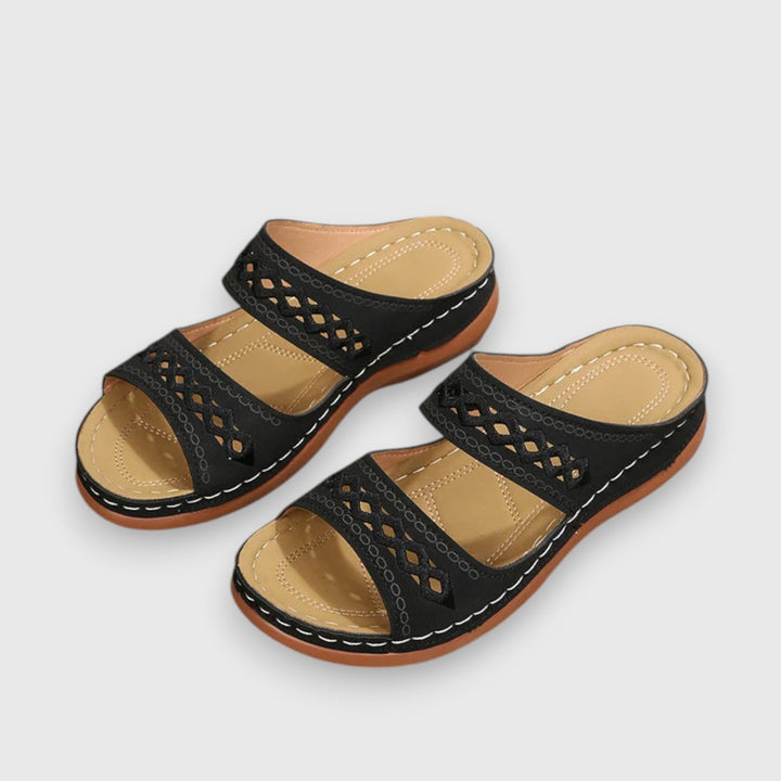 Stylish women's open-toe sandals with a relaxed wide fit for summer days.