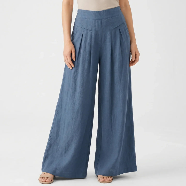 Stylish high-rise wide-leg pants for women, featuring a loose, flowy fit and comfortable elastic waist.