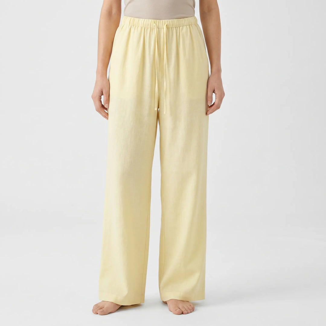 High-waisted women's wide-leg summer pants with drawstring, ideal for breezy vacation fashion.