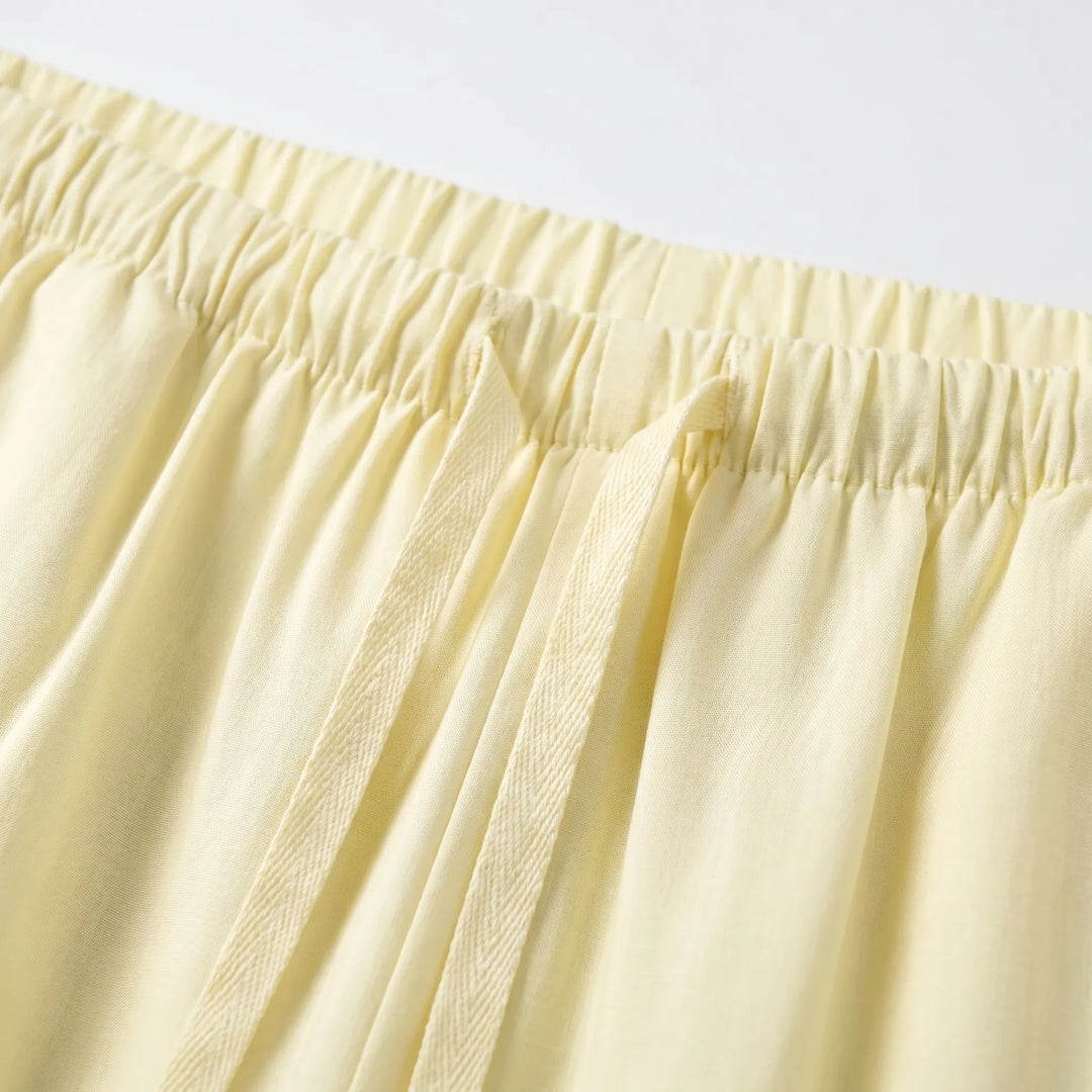 Flowy solid color wide-leg summer pants for women, offering a comfortable and loose fit.