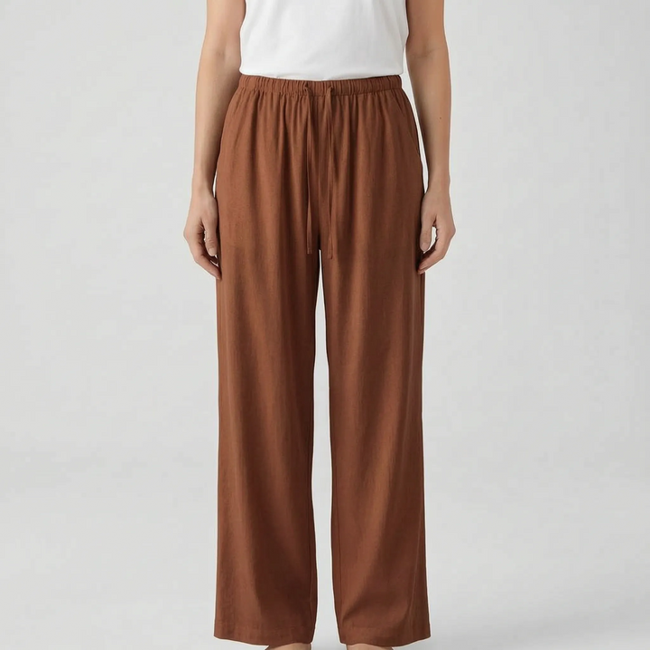 Solid color flowy wide-leg pants for women, comfortable and loose fit for summer fashion.