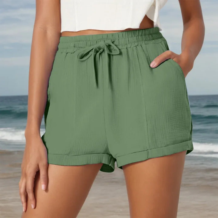Women's comfortable drawstring shorts with side pockets, ideal for relaxed summer days & casual outfits.