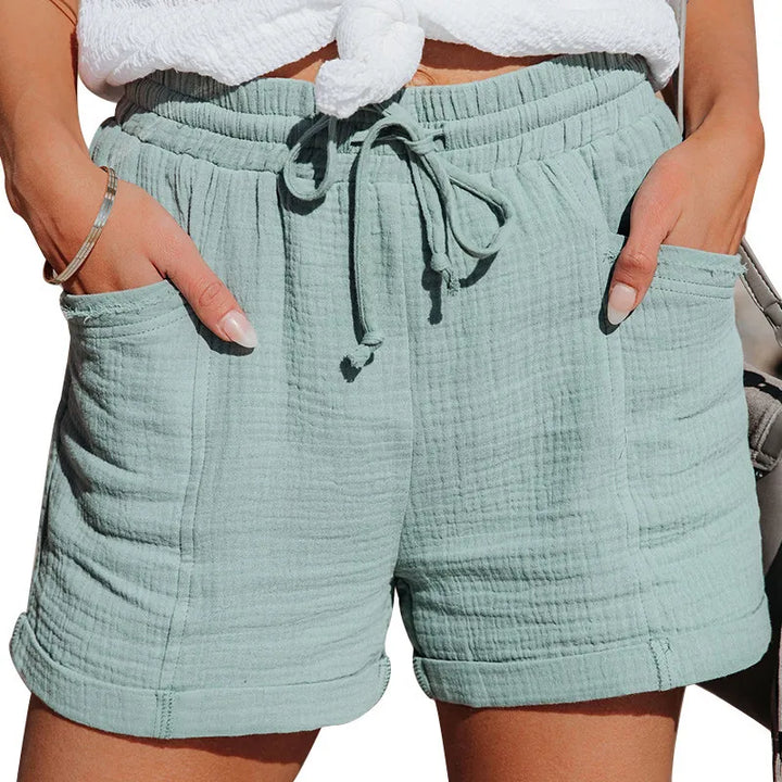 Easy-wear women's pull-on shorts with an adjustable drawstring waist and convenient functional pockets.