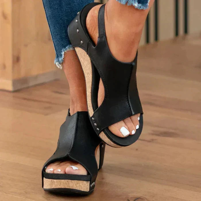 Open-toe women's wedge sandals with an adjustable strap, offering orthopedic comfort for everyday wear.