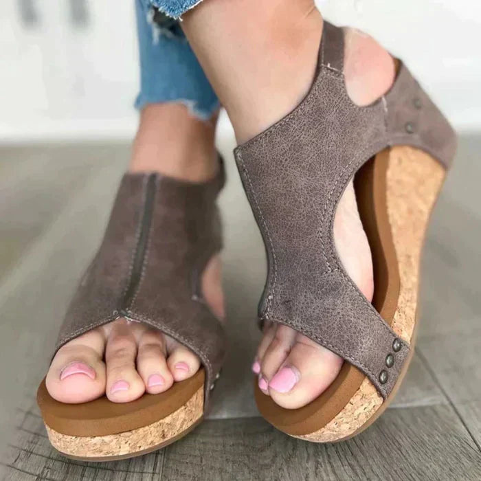 Black orthopedic wedge sandals for women, offering superior arch support and a cushioned, comfortable sole.