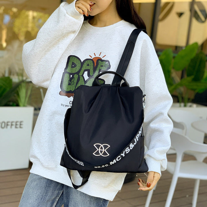 Women's convertible anti-theft travel backpack. Secure black bag converts to shoulder bag, ideal for travel & daily use.