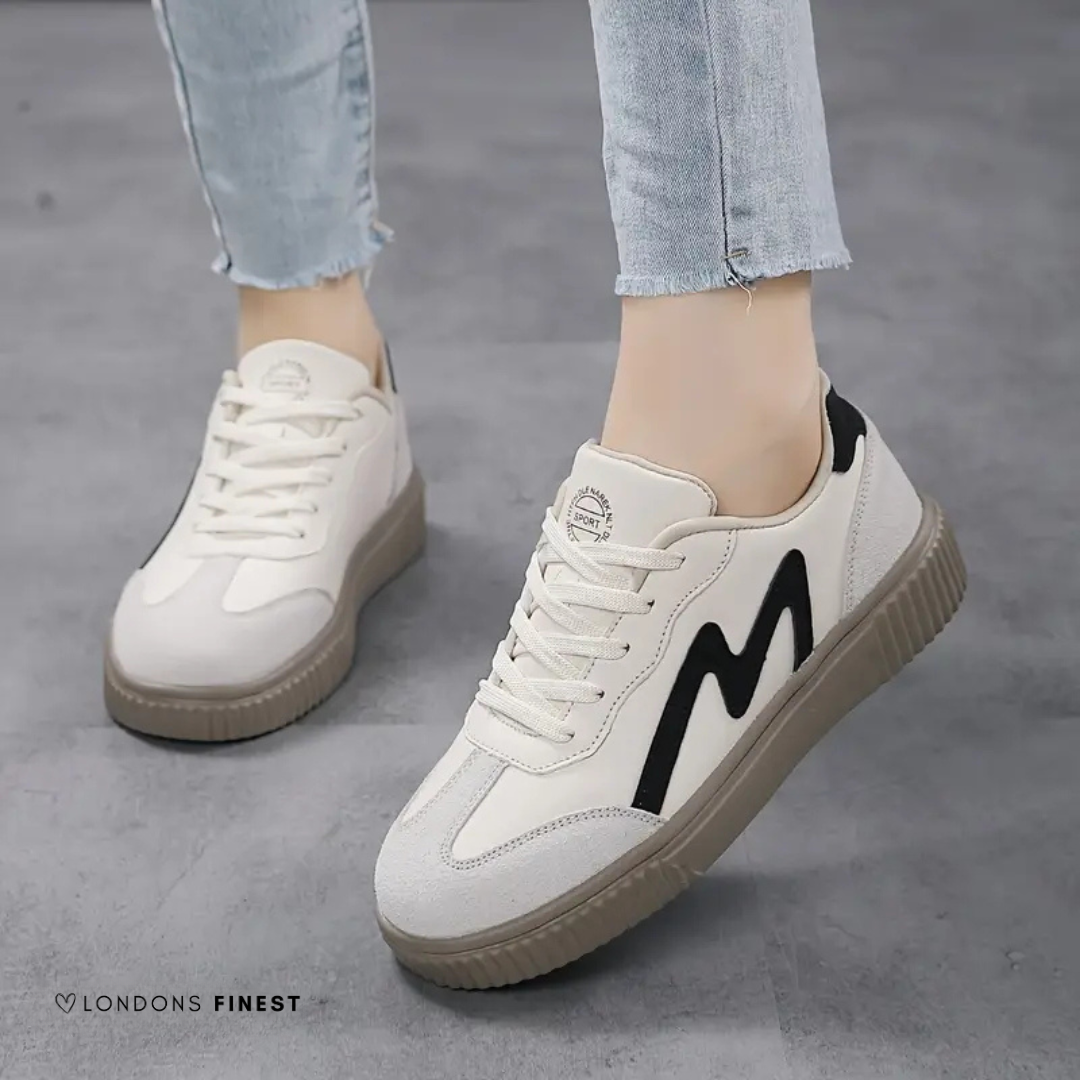 Stylish Corinne ladies sneakers in gray, providing ultimate comfort & support for all-day wear and foot wellness.