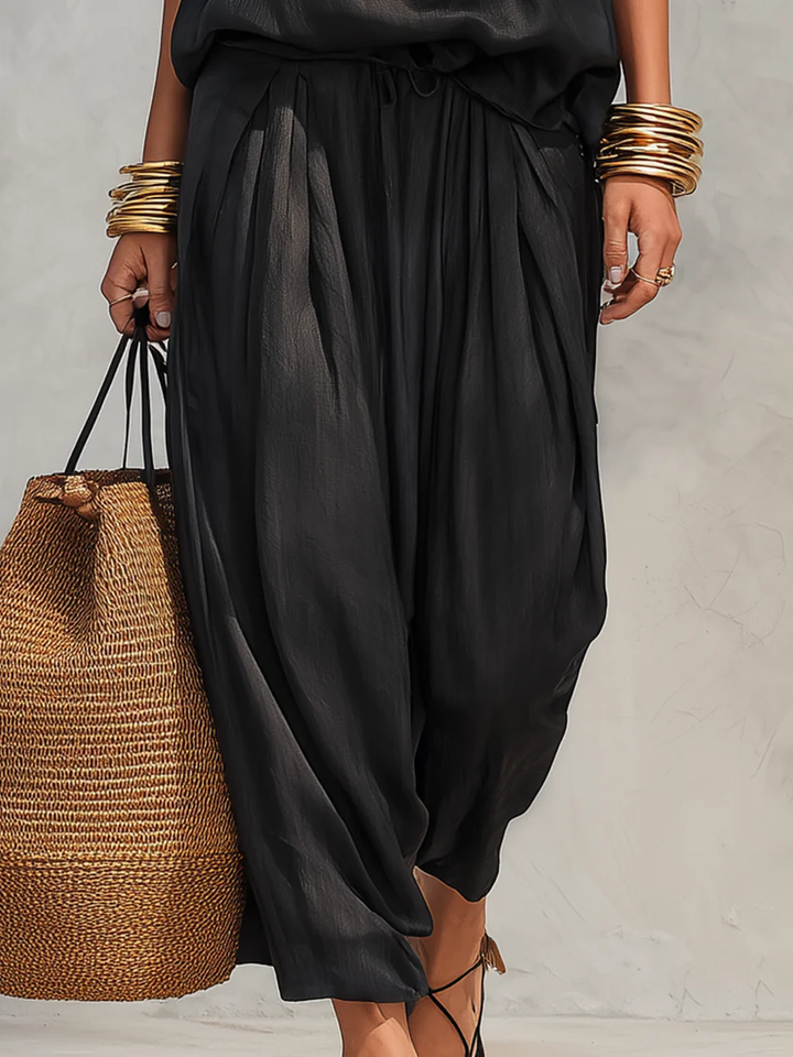 Versatile women's cowl neck halter top & wide leg pant set, perfect for vacation, summer or evening wear.