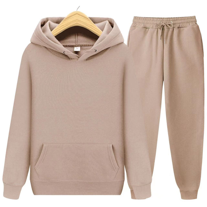 Model wearing a plush women's loungewear set: hoodie & joggers, for ultimate comfort & style.