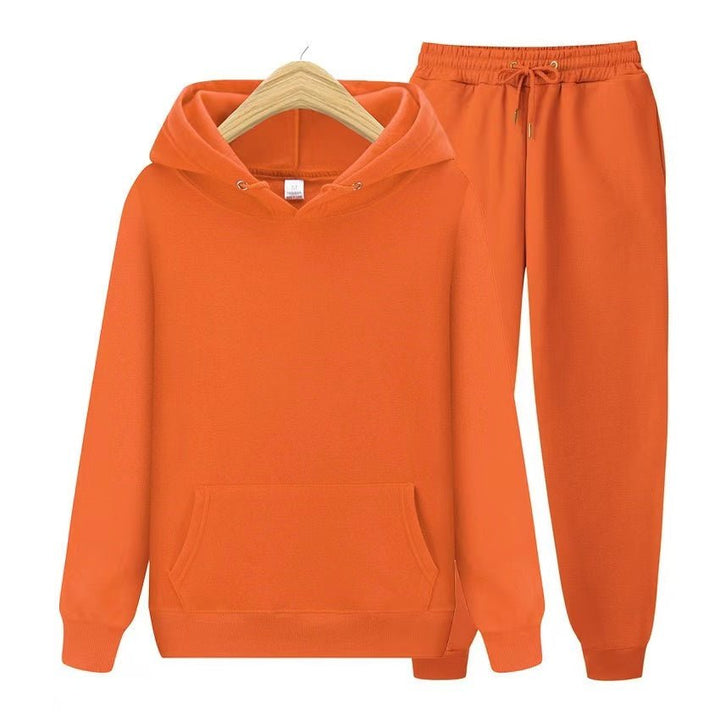 Folded women's sweatshirt and jogger set, showcasing soft fleece fabric texture & quality.