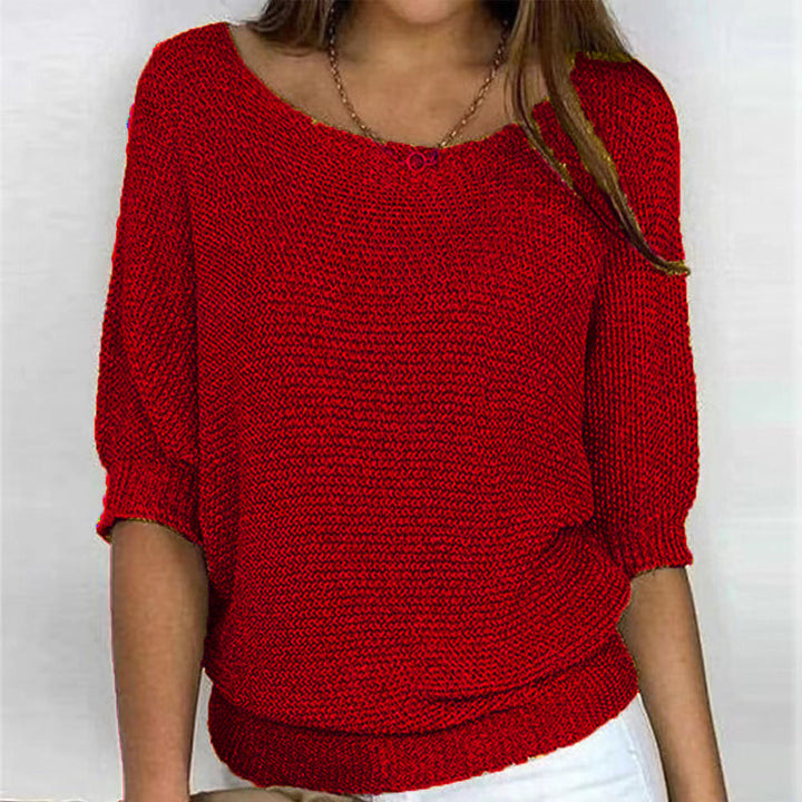 Women's warm long-sleeve pullover sweater, soft knit for cozy winter comfort.