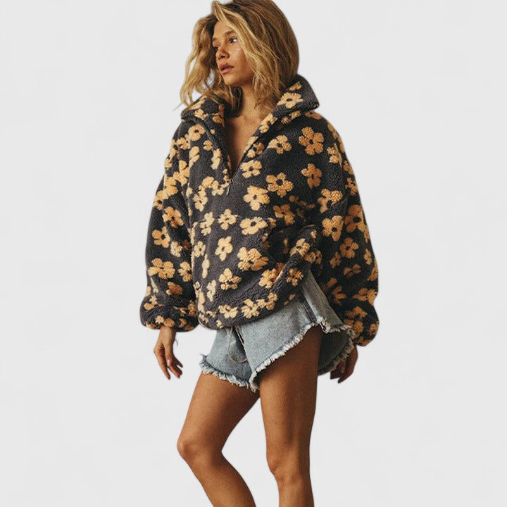 Stylish women's quarter-zip pullover sweater featuring an elegant floral pattern, ideal for a chic fall look.