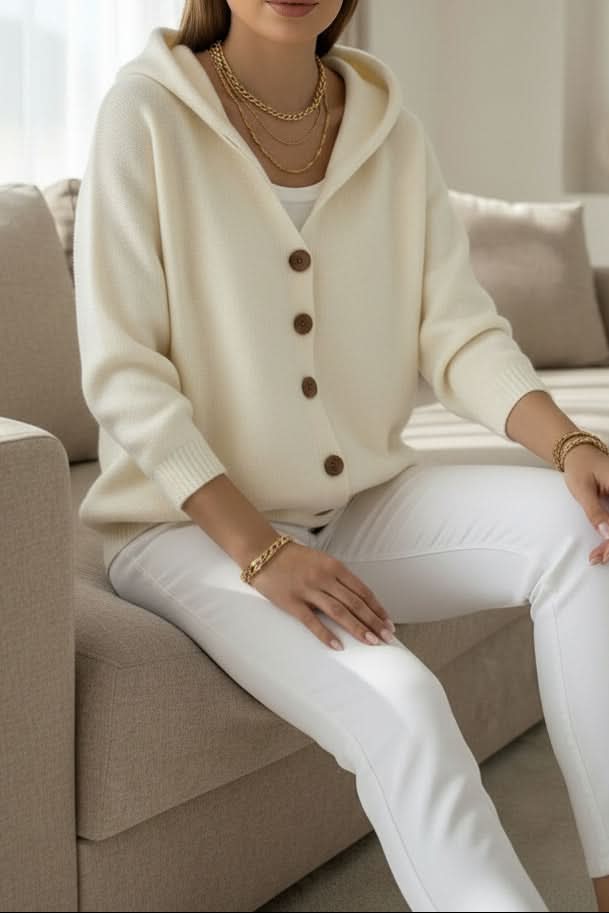 Fall fashion essential: women's cozy hooded sweater with a relaxed fit for comfort.