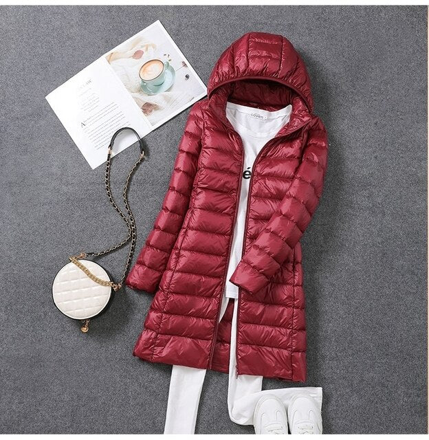 Women's cozy hooded long puffer coat, perfect for warm winter outerwear & cold weather protection.