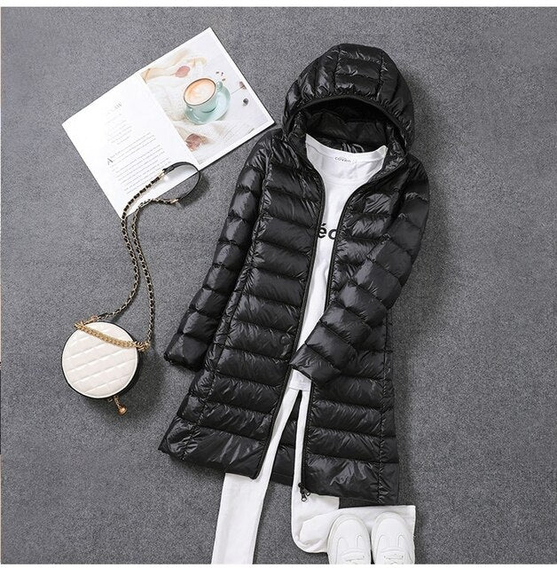Warm hooded long puffer coat for women, excellent winter outerwear offering cozy protection from cold.