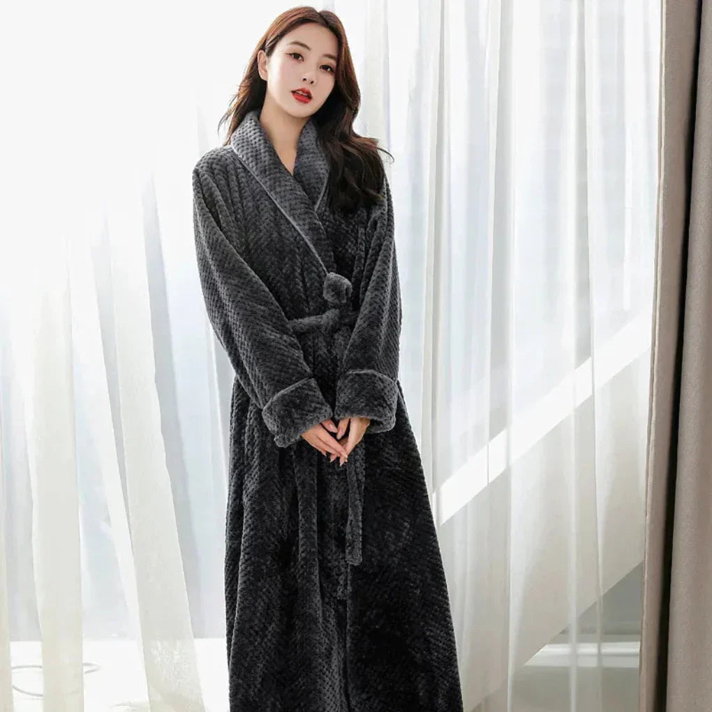 Relaxing women's hooded plush robe, offering cozy warmth and comfort for homewear.