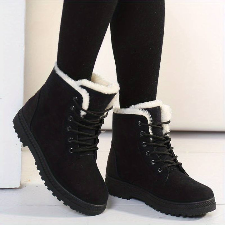 Women's cozy insulated winter boots with ultimate warmth, ideal for snow & cold weather. Features a durable traction sole.