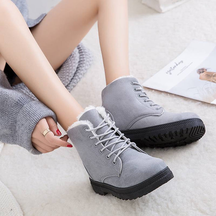 Stylish women's lace-up insulated winter boots, offering cozy warmth & excellent traction for cold weather adventures.