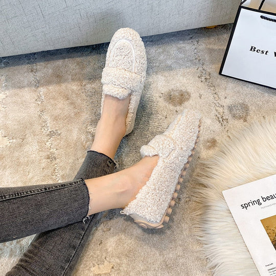 Stylish women's loafer slippers, ideal indoor footwear for cloud-like comfort at home.