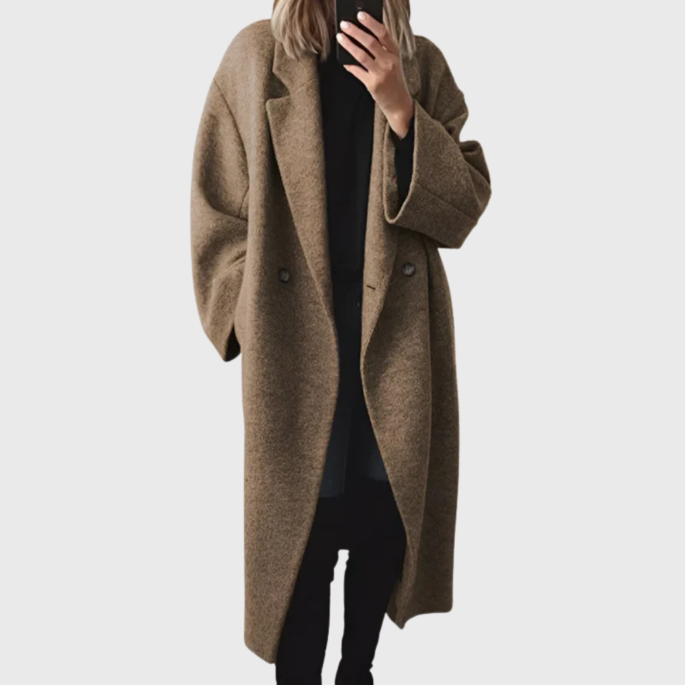 Elegant women's grey longline overcoat, offering warmth & style for fall and winter. A comfortable midi fashion jacket.