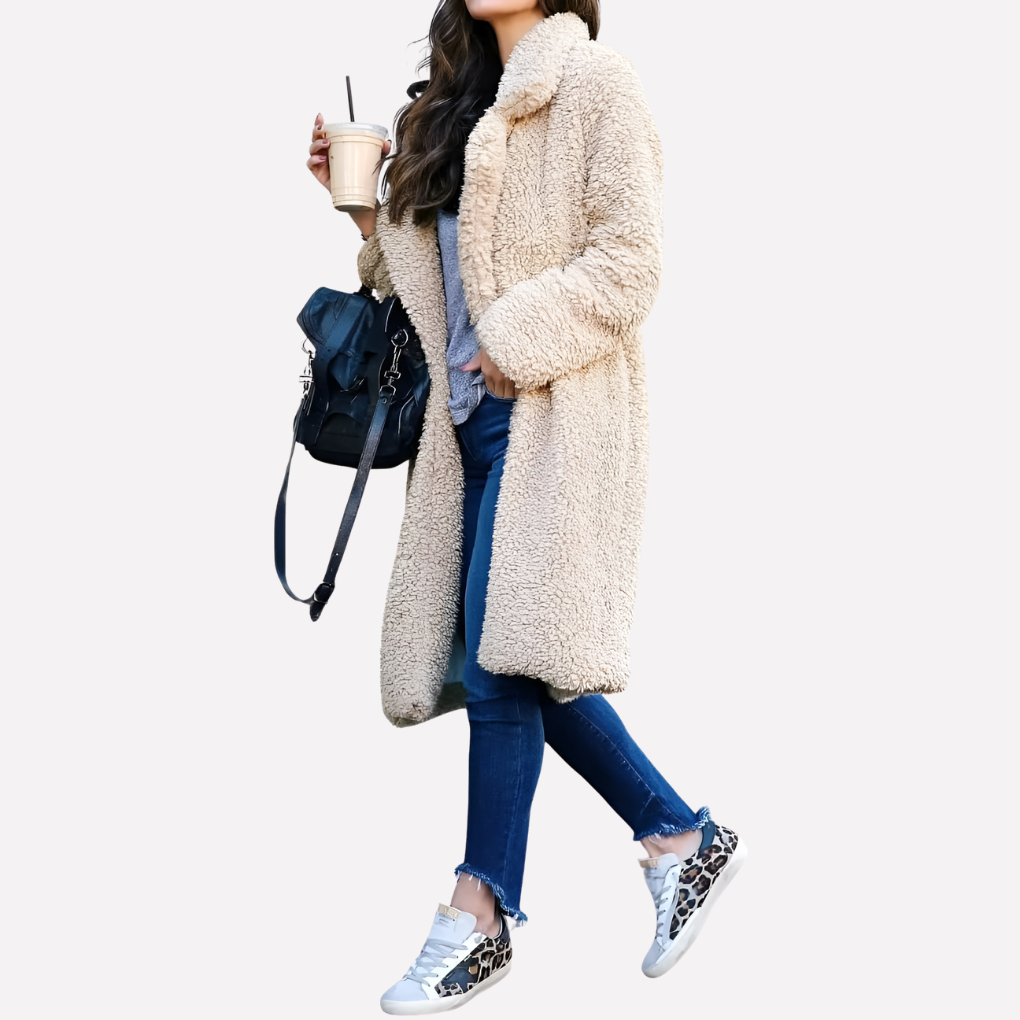 Comfortable women's longline teddy jacket, a cozy winter fashion essential. Features a chic, warm design.
