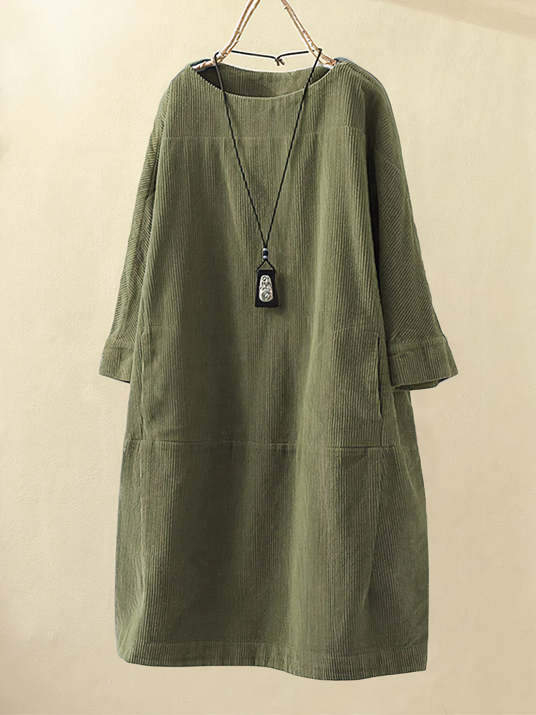 Women's cozy midi dress with pockets, featuring elbow sleeves & round neck. Perfect for casual fall & winter wear.