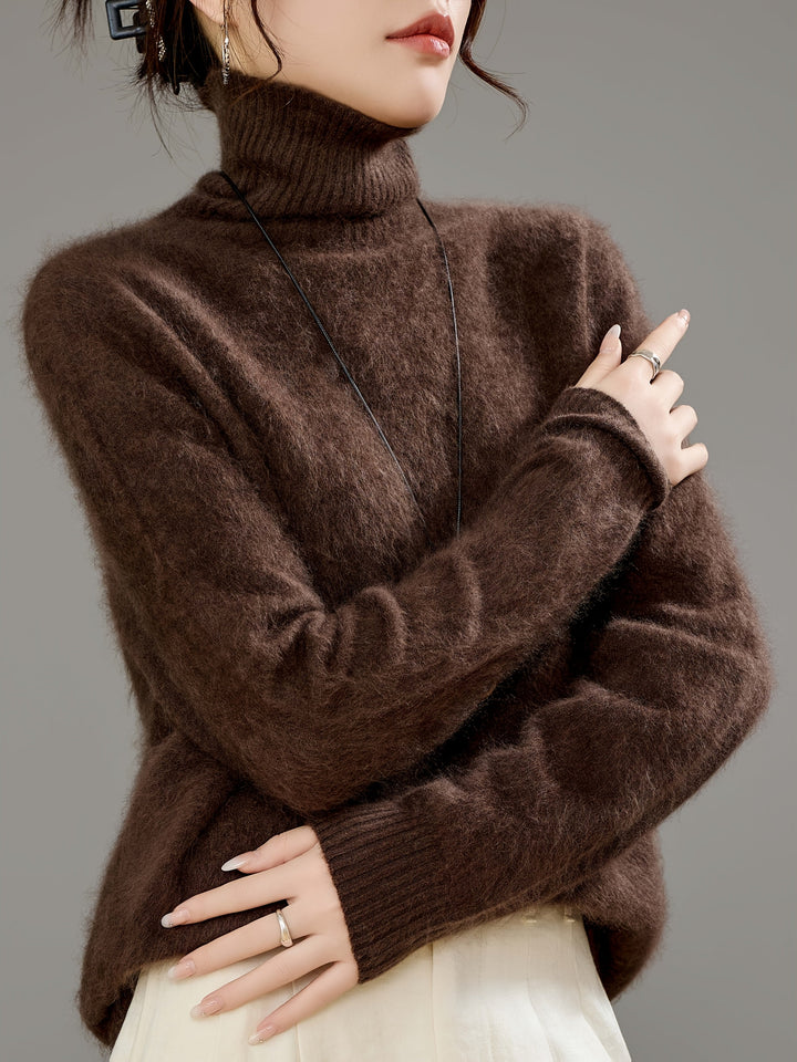 Women's cozy oversized turtleneck sweater in soft knit, perfect for warm winter fashion.