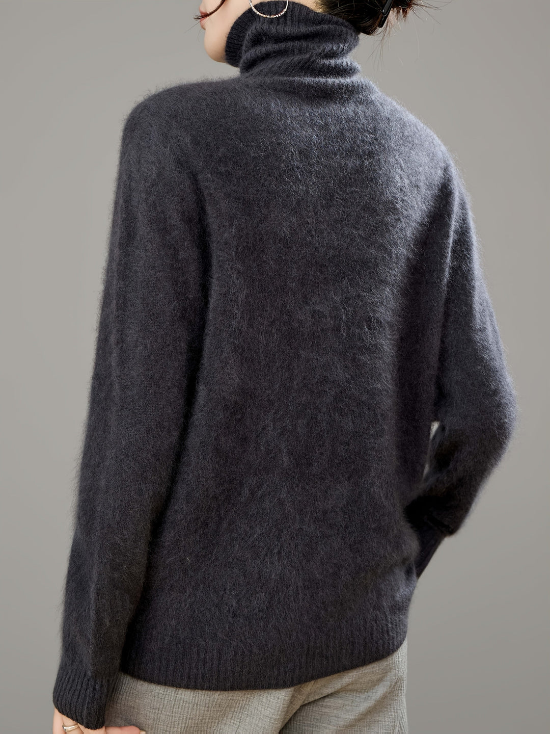 Warm and cozy women's oversized turtleneck sweater, essential for comfortable winter style.