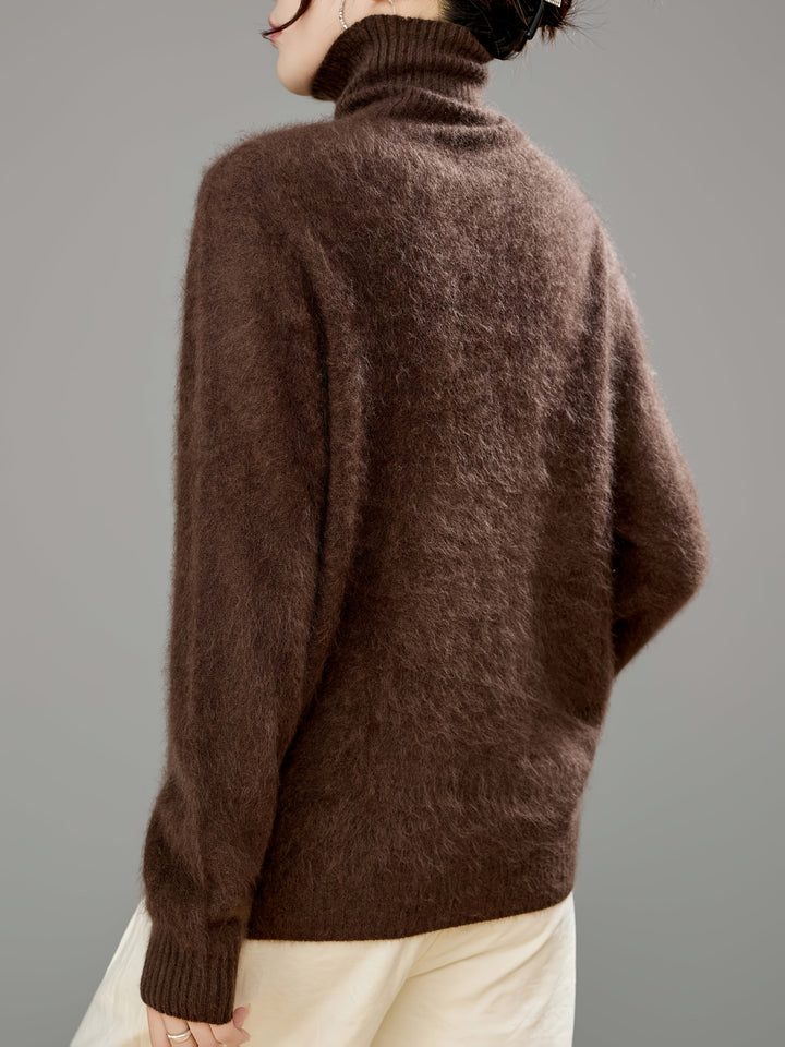 Relaxed fit women's turtleneck sweater, elegant yet cozy for premium winter fashion.